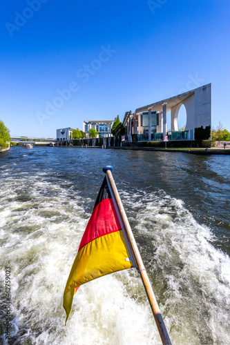 Germany, Berlin, Chancellery and German flag on excursion boat on River Spree photo