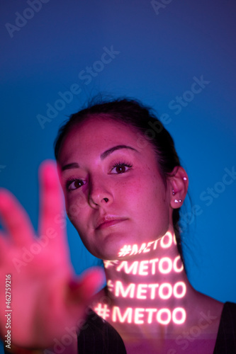 Portrait of woman with hastag metoo on her neck photo