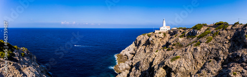 Spain, Mallorca, Cala Ratjada, Helicopter view of Far de Capdepera lighthouse in summer photo