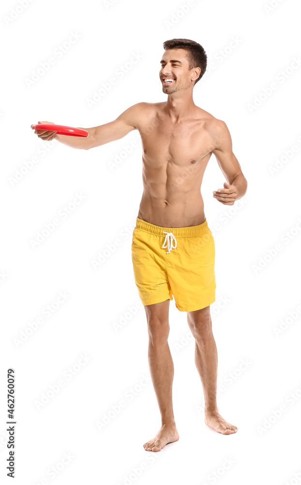 Young man throwing frisbee on white background