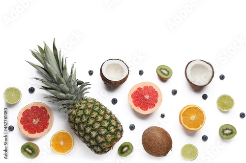 Composition with different fruits and berries on white background