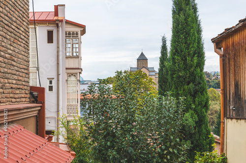 Georgia, Tbilisi, houses in bath district Abanotubani and view to Metekhi Church photo