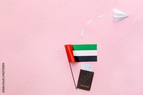 Billede på lærred National United Arab Emirates flag, passport and paper plane on pink background