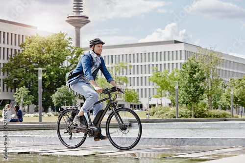 Student on his e-bike at Goethe University in Frankfurt, Germany photo