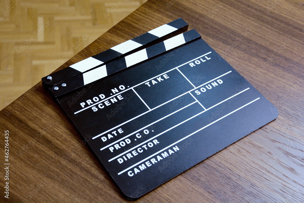 High angle view of film slate on wooden table High angle view of film slate on wooden table