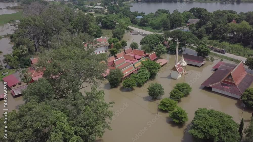 Drone slowly descends over a temple complex in Thailand close to Ayutthaya that has been flooded by the overflowing river. Many Thais have been displaced by the natural disaster. Drone slowly descends over a temple complex in Thailand close to Ayutthaya that has been flooded by the overflowing river. Many Thais have been displaced by the natural disaster.