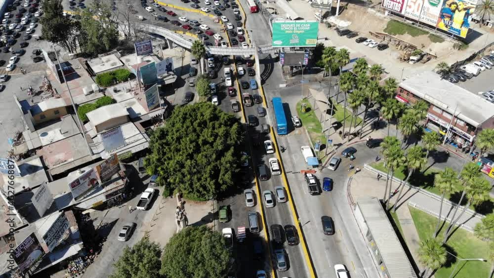 4k video horizont revealing shot of comercia locals and cars under Tijuana side waiting to cross to San Diego port of entry 4k video horizont revealing shot of comercia locals and cars under Tijuana side waiting to cross to San Diego port of entry