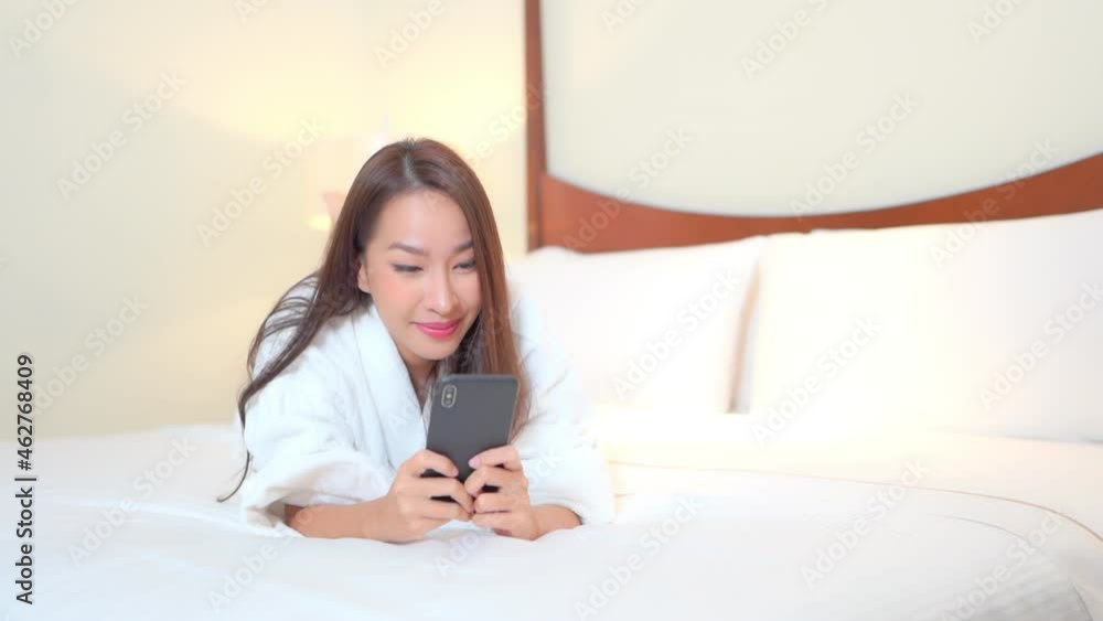Young Beautiful Asian Woman Playing Online Video Game on Smartphone, Full Frame Slow Motion Young Beautiful Asian Woman Playing Online Video Game on Smartphone, Full Frame Slow Motion