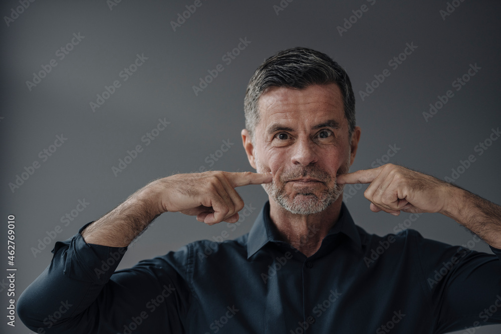 Portrait of funny mature businessman Portrait of funny mature businessman