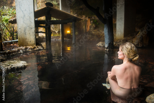 Japan, Kyushu, woman enjoying hot springs