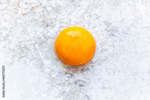 Close-up of single egg yolk photo