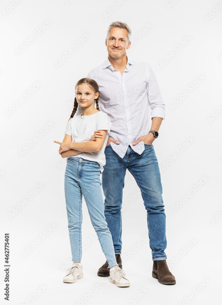 Smiling man standing with daughter against white background Smiling man standing with daughter against white background