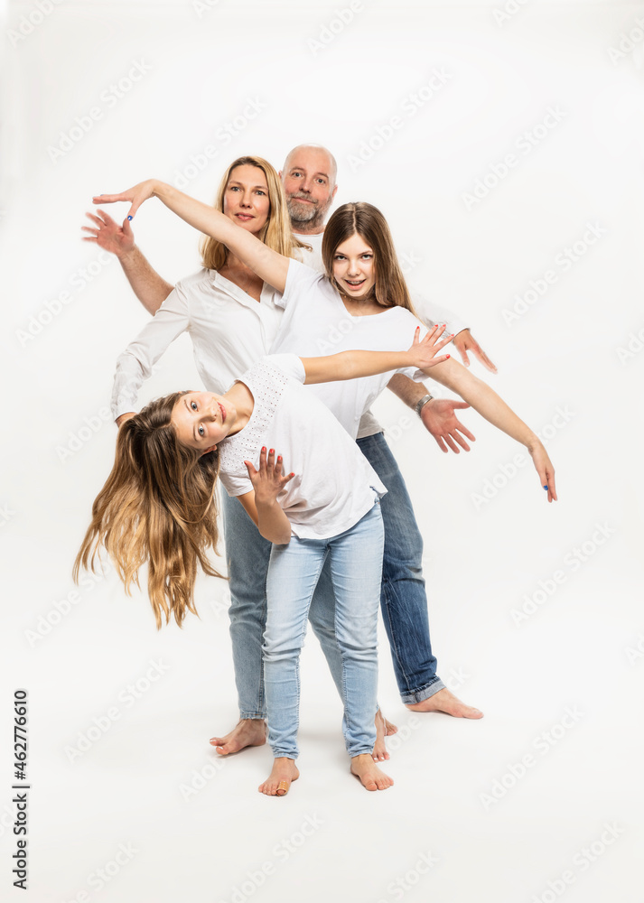 Daughters with parents gesturing against white background Daughters with parents gesturing against white background