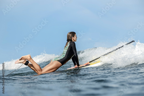 Female SUP surfer, Bali, Indonesia photo