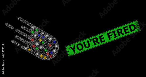 Bright mesh web bolide with colorful bright dots, and grunge You'Re Fired seal. Green seal includes You'Re Fired tag inside framed rectangle. Illuminated vector carcass created from bolide symbol.