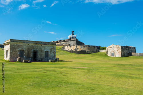 Fort San Felipe Del Morro on grassy land against blue sky, San Juan, Caribbean photo