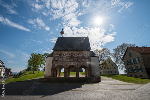 Germany, Hesse, Lorsch, Sun shining overÔøΩTorhalleÔøΩofÔøΩLorschÔøΩAbbey photo