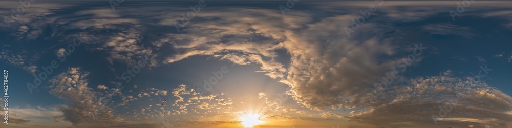 Golden sunset sky pano with Cumulus clouds. Seamless hdr panorama in spherical equirectangular format. Complete zenith for 3D visualization, game and sky replacement for aerial drone 360 panoramas.