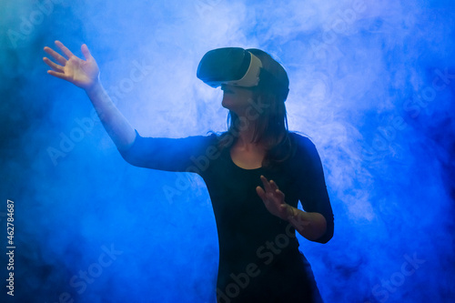 Woman with virtual reality glasses in the fog photo