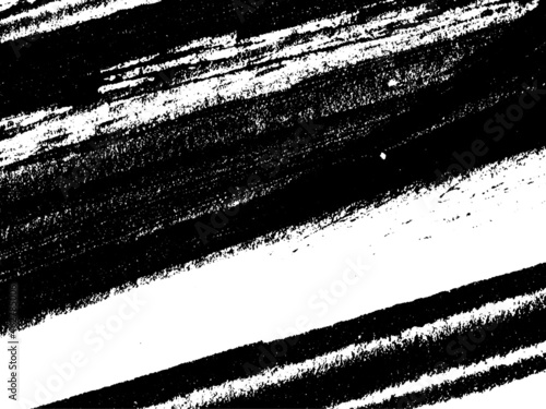Grunge is black and white. Texture of black strokes on a white background. Abstract chaotic movements with a dry brush. Monochrome pattern of worn surface