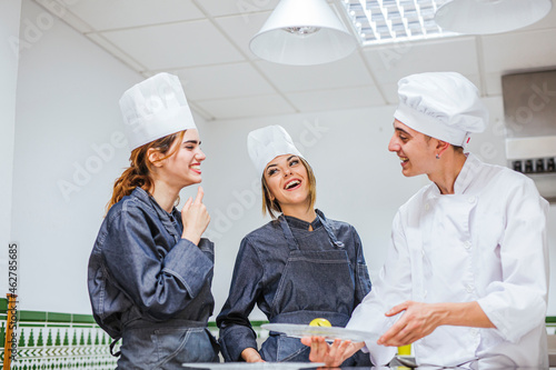 Junior chef showing his prepaired dessert on plate photo