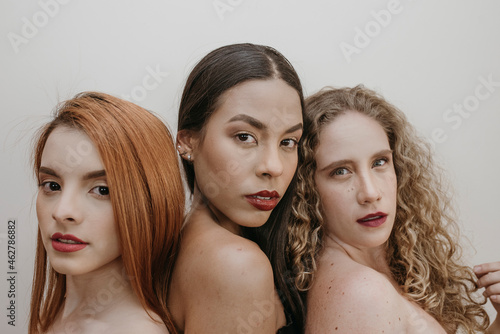 Beautiful multi ethnic women in red lipstick photo