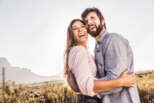 Portait of happy couple in barren landscape photo