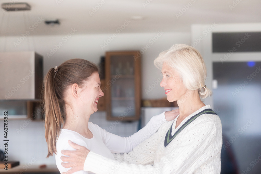 Mother and adult daughter having fun together at home Mother and adult daughter having fun together at home