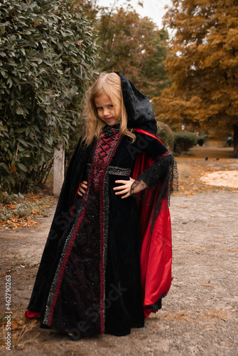 a girl in a witch costume for Halloween depicts fear and horror