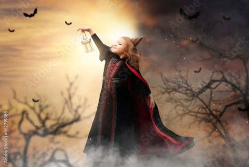 terribly beautiful witch for the holiday Halloween in a fabulous processing for advertising with space for text