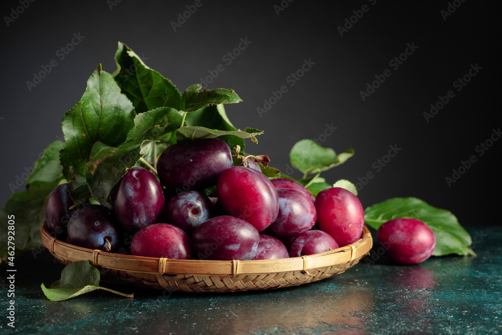Purple plums with leaves. Purple plums with leaves.