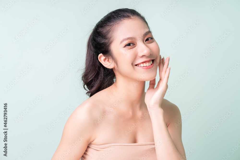 Beautiful young Asian woman with fresh skin. Face care, facial treatment, , woman beauty skin isolated on green background. cosmetology, beauty skin and cosmetic Beautiful young Asian woman with fresh skin. Face care, facial treatment, , woman beauty skin isolated on green background. cosmetology, beauty skin and cosmetic