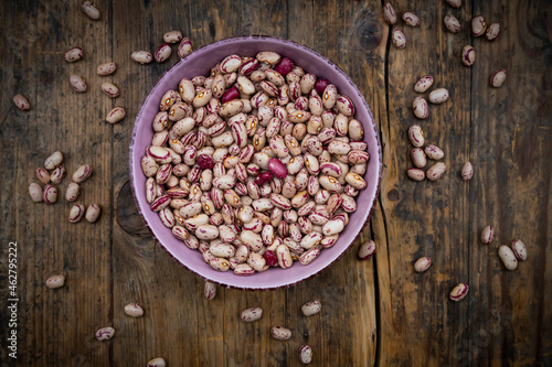 Bowl of dried pinto beans in bowl photo