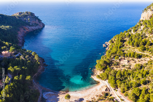 Spain, Balearic Islands, Drone view of Cala Tuent bay in summer photo