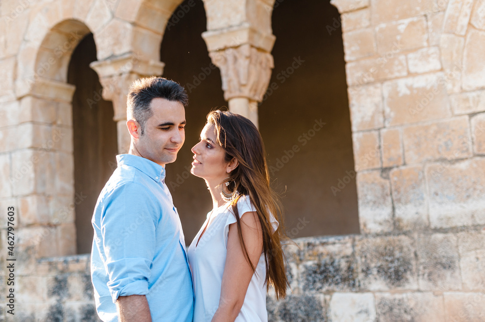 Woman admiring boyfriend while standing by Roman church Woman admiring boyfriend while standing by Roman church