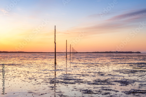 United Kindom, England, Northumberland, posts marking the pilgrims way crossing to Lindisfarne, Holy Island photo