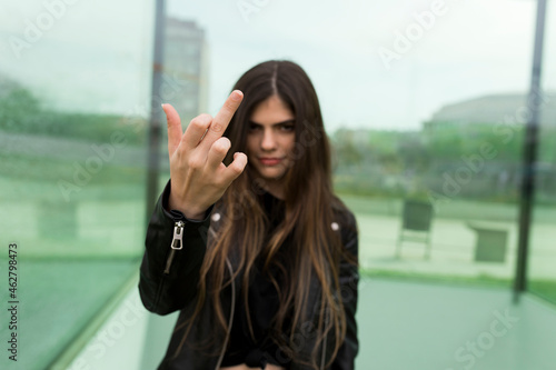 Young woman giving the finger photo