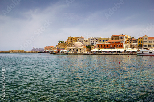 Greece, Crete, Chania, Harbor of coastal city with Kucuk Hasan Pasha Mosque in background photo