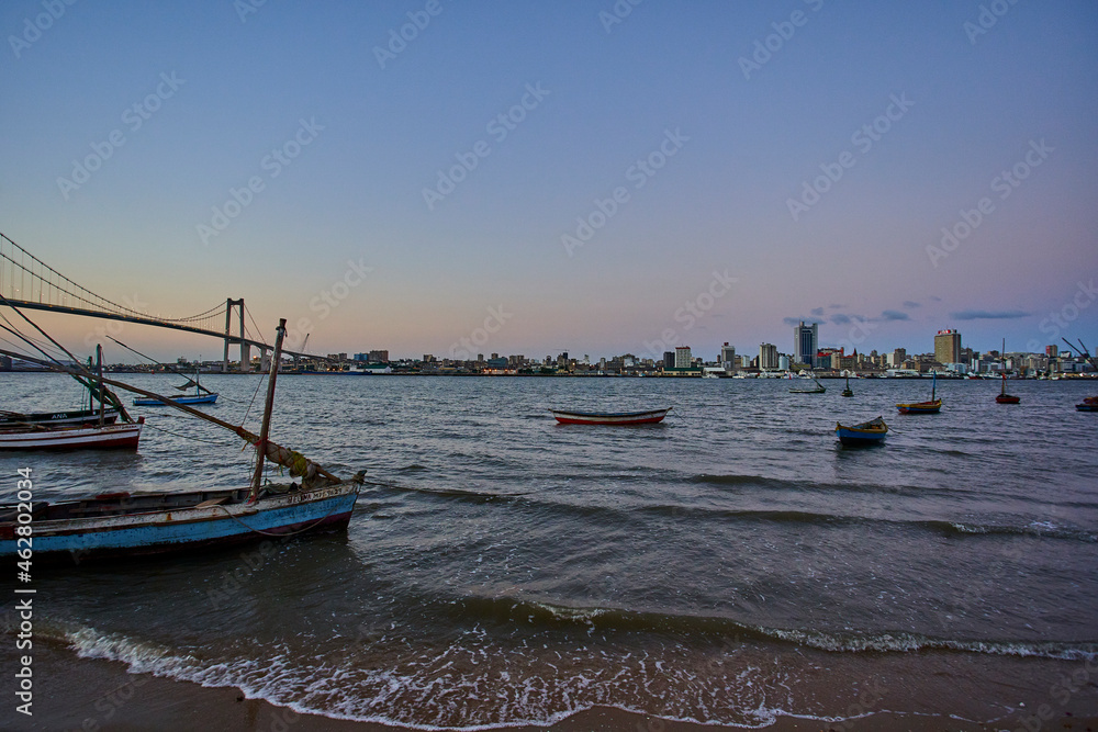 Small boats with view to the skyline of Maputo, Catembe, Mozambique Small boats with view to the skyline of Maputo, Catembe, Mozambique