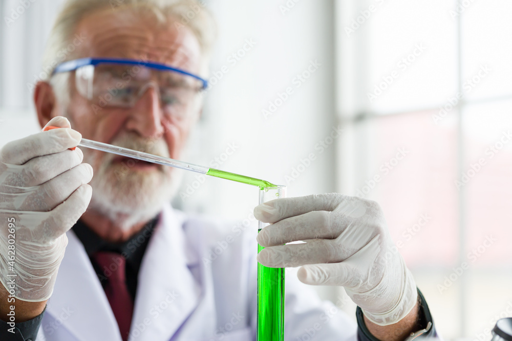 Senior scientist is conducting scientific research in the laboratory. Senior scientist is conducting scientific research in the laboratory.