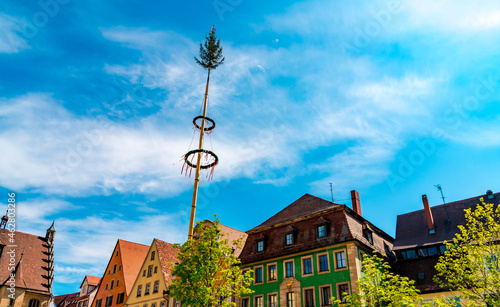 Historic architecture with traditional maypole in Weissenburg, Bavaria, Germany photo