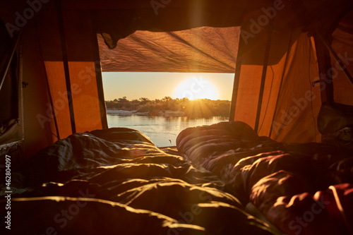 Scenic view of river seen from tent at Caprivi Strip during sunset, Namibia photo