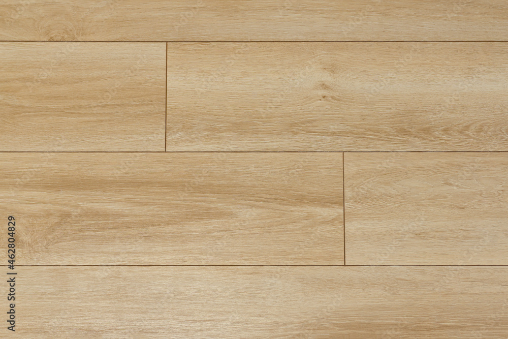 Laminate background. Wooden laminate and parquet boards for the floor in interior design. Texture and pattern of natural wood. Laminate background. Wooden laminate and parquet boards for the floor in interior design. Texture and pattern of natural wood.