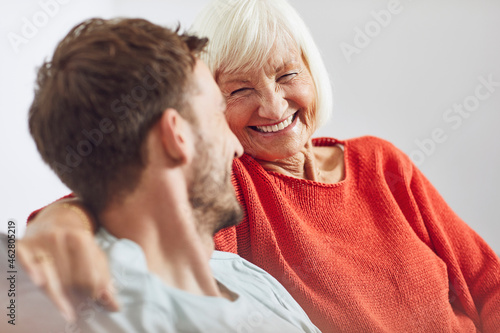 Portrait of senior woman with her grown-up grandson