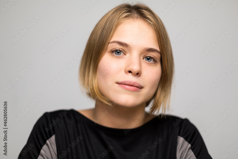 Portrait of blond young woman with bob hairdo Portrait of blond young woman with bob hairdo