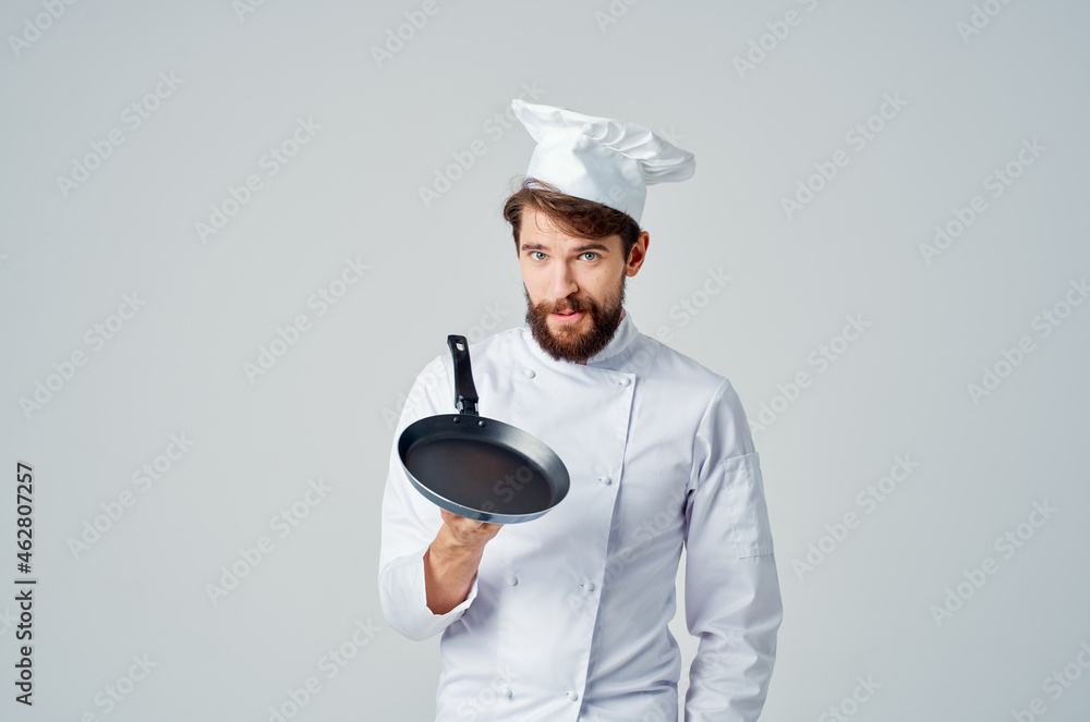 male cook with a frying pan in hand culinary industry male cook with a frying pan in hand culinary industry