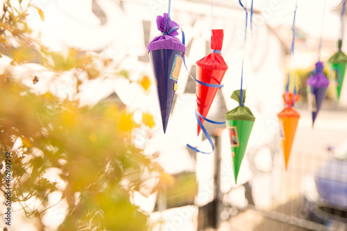 Miniature school cones hanging in a row photo