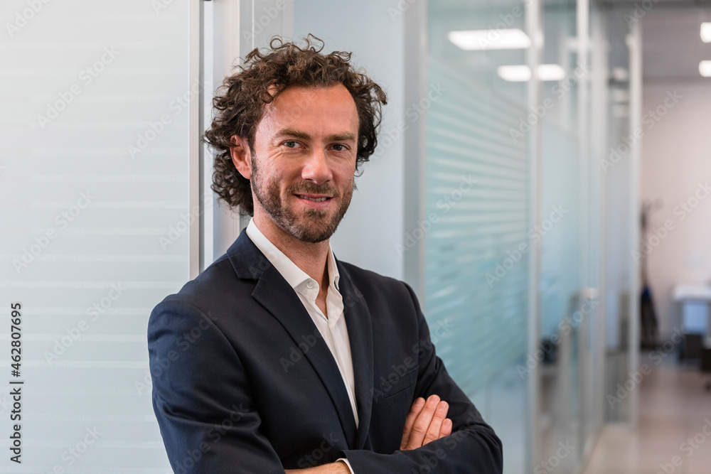 Portrait of confident businessman in office Portrait of confident businessman in office