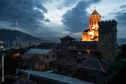 Georgia, Tbilisi, Holy Trinity Cathedral illuminated at dusk photo