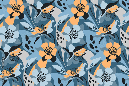 Vector floral seamless pattern. Flower background. Orange, blue flowers, buds, leaves isolated on a blue background.